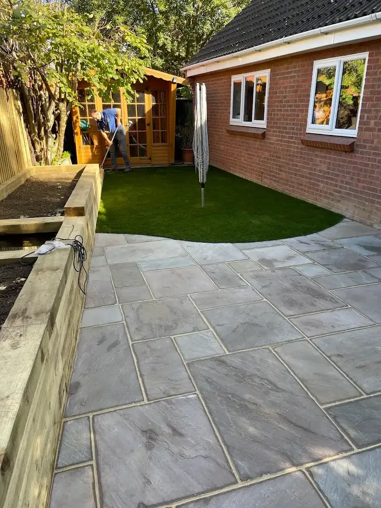 WV Landscapes sandstone paving, raised garden bed and lawn installation